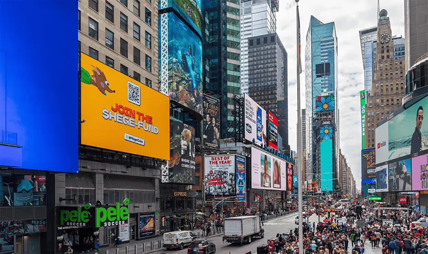 Billboard in Times Square, New York City, showing a Hege ad.